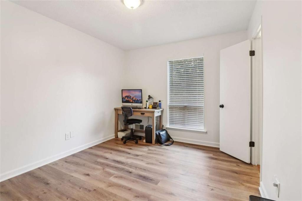 9202 Settlers Grove Road Northeast Covington, GA 30014 - Photo 28 of 45 a view of a workspace with furniture and a window