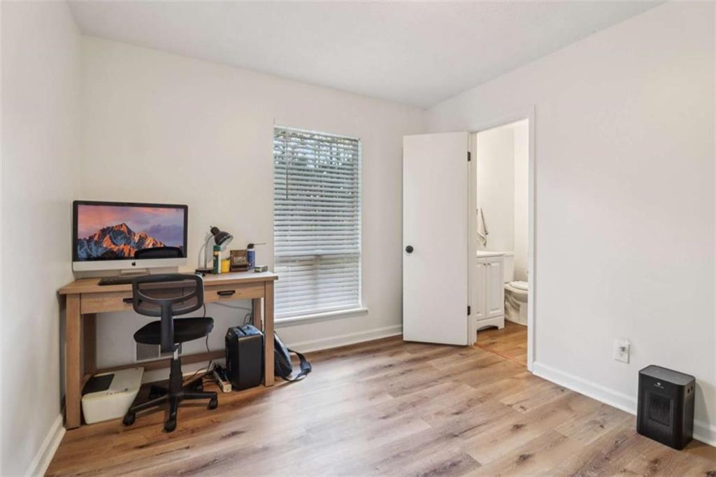 9202 Settlers Grove Road Northeast Covington, GA 30014 - Photo 29 of 45 a view of a workspace with furniture and a window