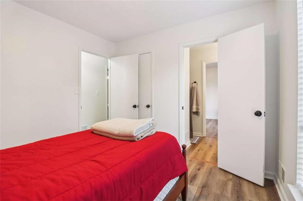 9202 Settlers Grove Road Northeast Covington, GA 30014 - Photo 35 of 45 a bedroom with a bed and a closet