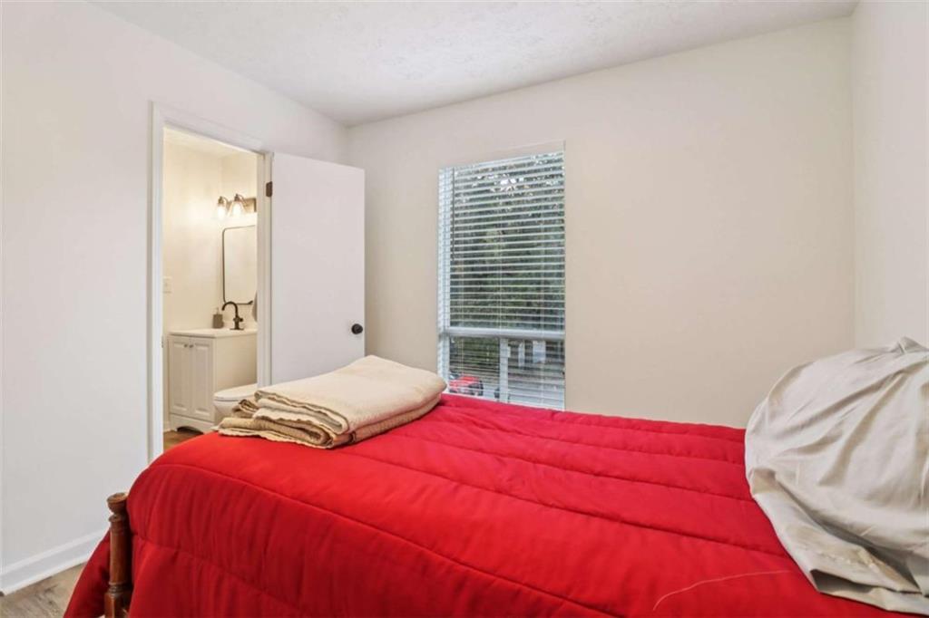 9202 Settlers Grove Road Northeast Covington, GA 30014 - Photo 36 of 45 a bedroom with a bed and a window