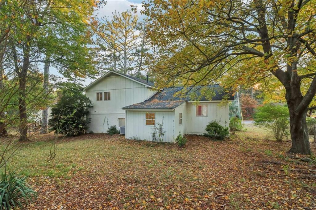 9202 Settlers Grove Road Northeast Covington, GA 30014 - Photo 44 of 45 a view of a house with a tree in the yard