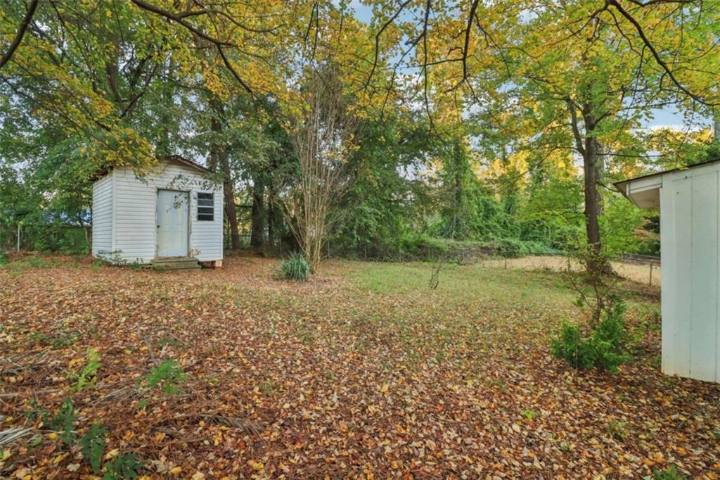 9202 Settlers Grove Road Northeast Covington, GA 30014 - Photo 45 of 45 a view of a house with a yard