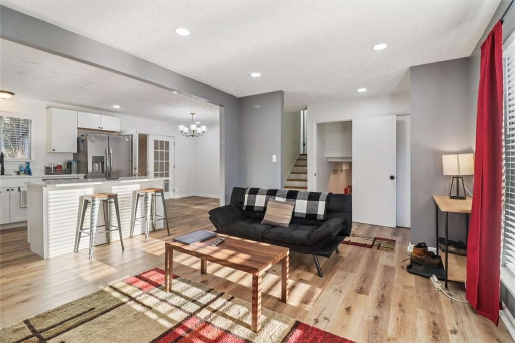 9202 Settlers Grove Road Northeast Covington, GA 30014 - Photo 8 of 45 a living room with furniture and a wooden floor