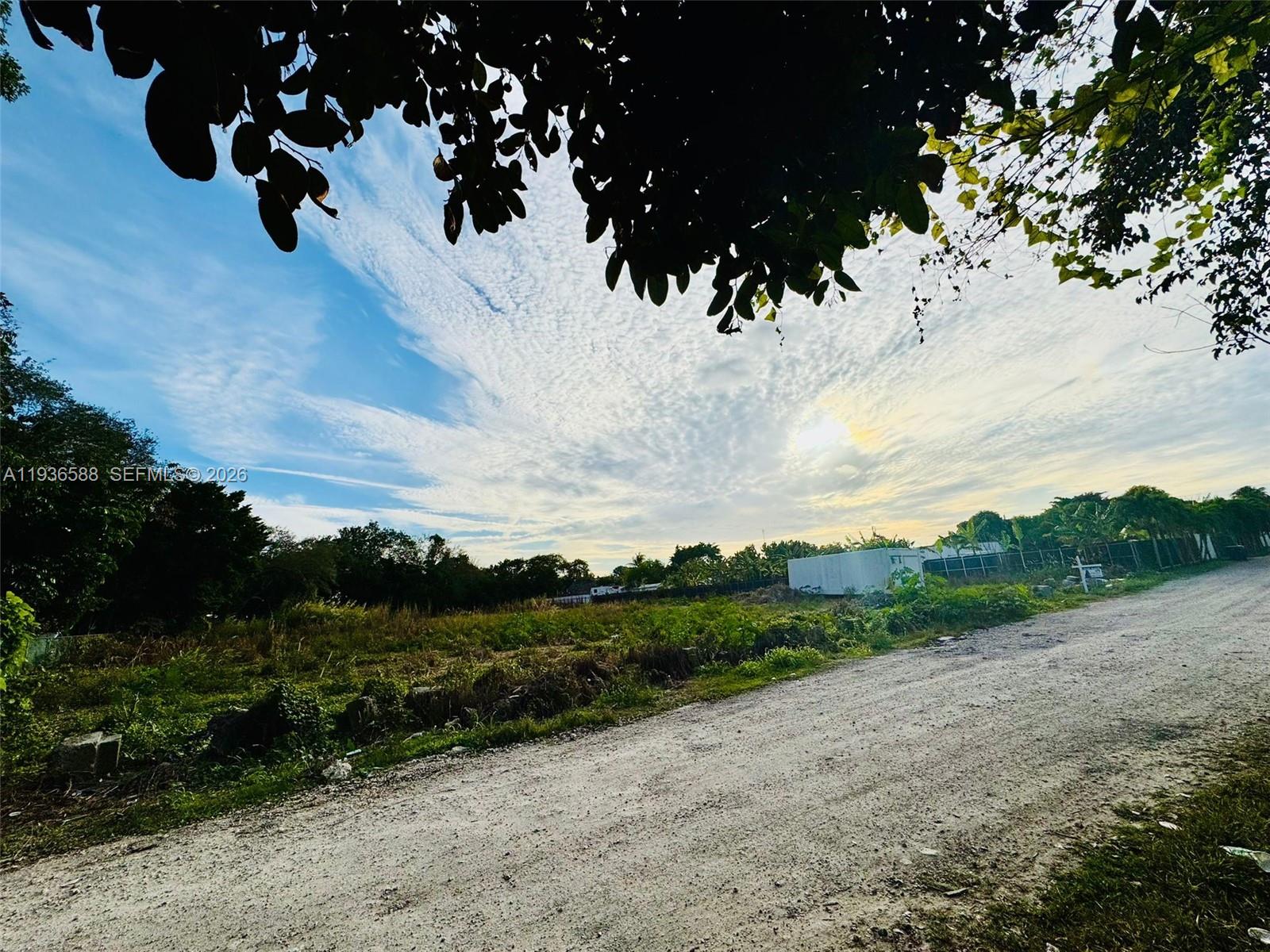 12330 Southwest 240th Street Homestead, FL 33032 - Photo 3 of 5 a view of a dry yard with wooden fence