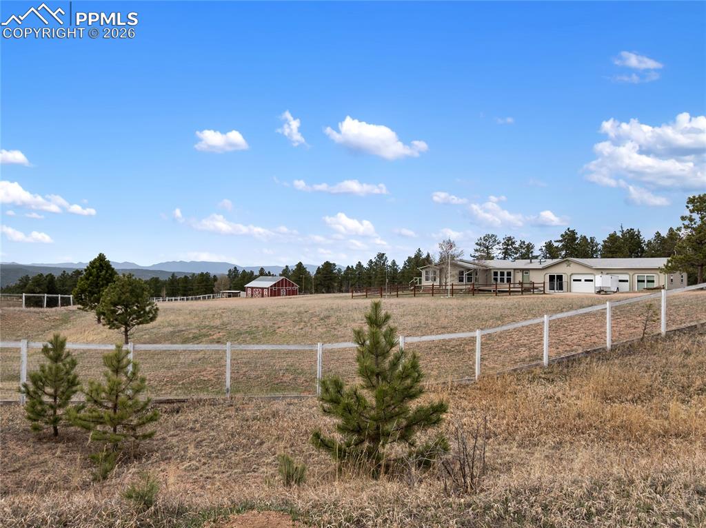 585 Mills Ranch Road Woodland Park, CO 80863 - Photo 13 of 46 View of yard featuring a view of countryside