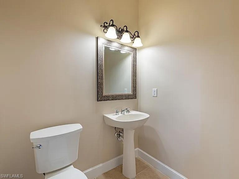 3590 Lansing Loop, Unit 201 Estero, FL 33928 - Photo 7 of 18 a bathroom with a sink and a mirror