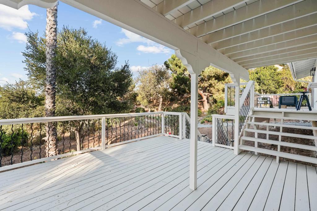 1608 Towell Lane Escondido, CA 92029 - Photo 17 of 35 a view of a balcony with wooden floor and outdoor space