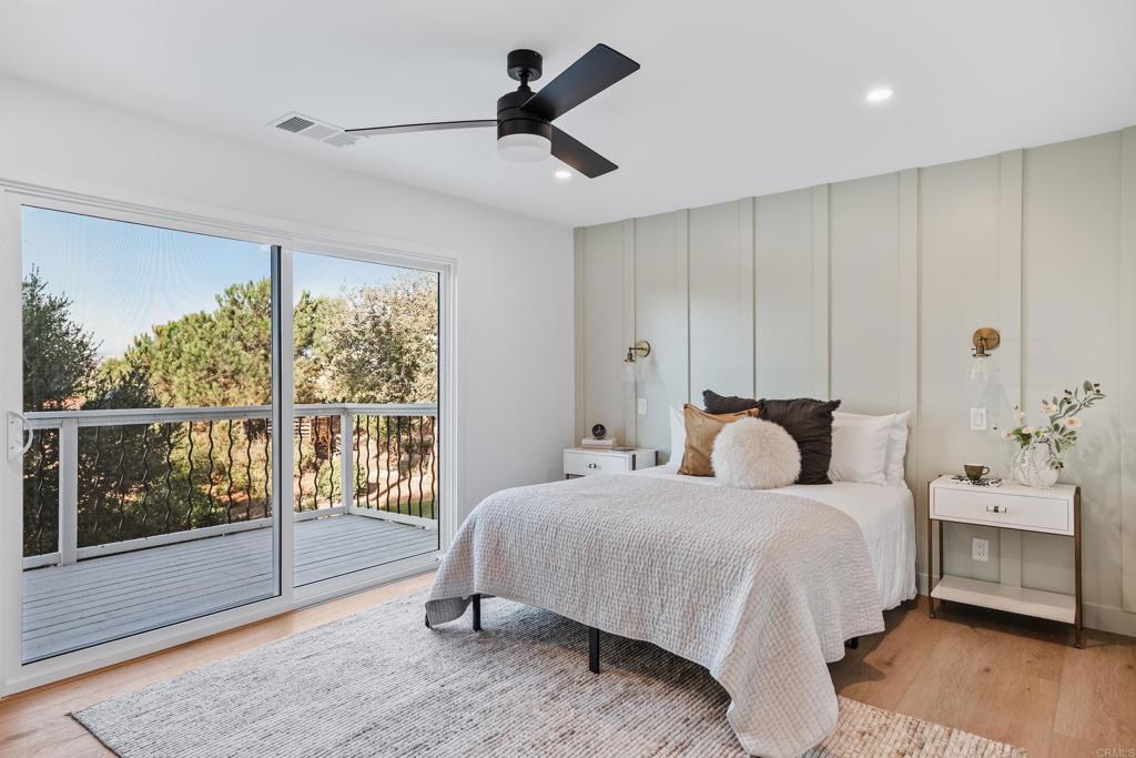 1608 Towell Lane Escondido, CA 92029 - Photo 18 of 35 a bedroom with a bed and a night stand