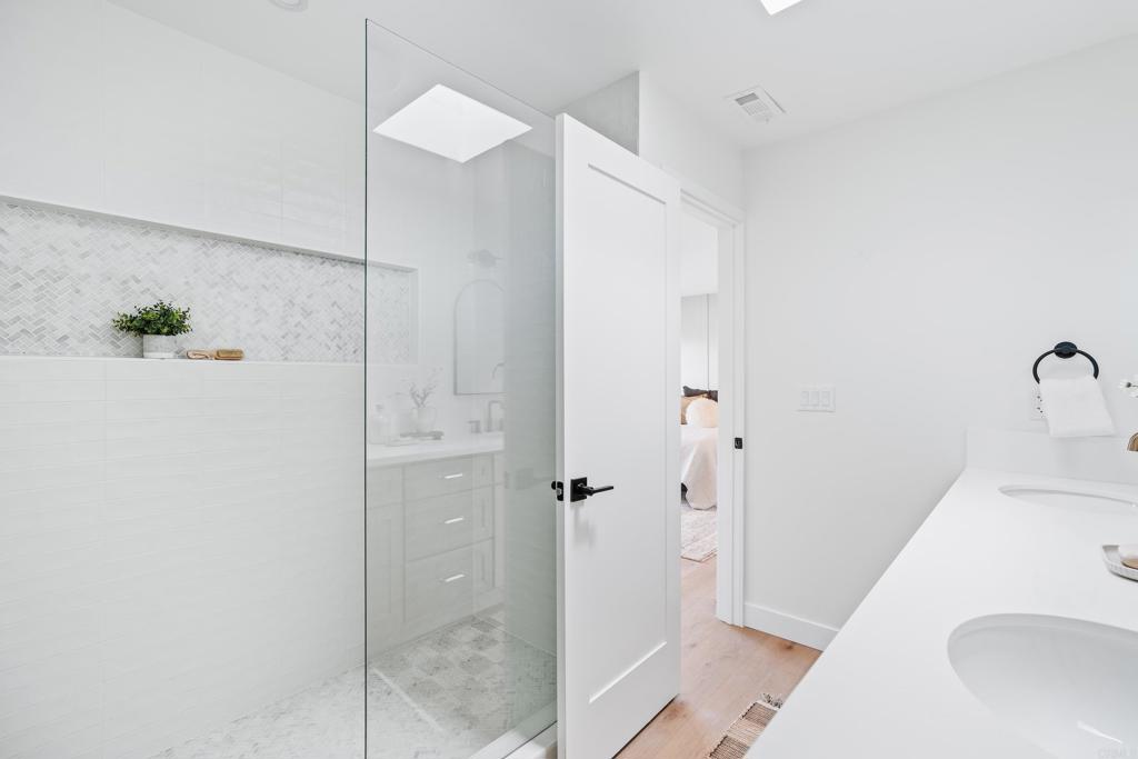 1608 Towell Lane Escondido, CA 92029 - Photo 25 of 35 a bathroom with a sink and shower