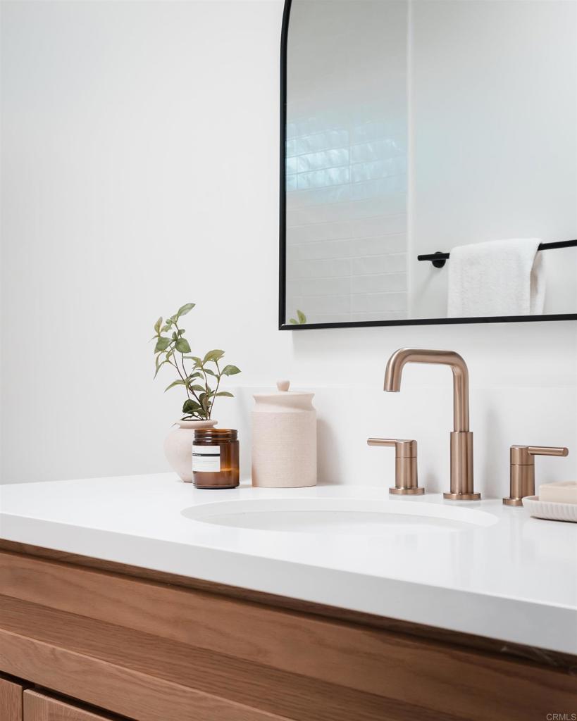 1608 Towell Lane Escondido, CA 92029 - Photo 28 of 35 a bathroom with a sink and a mirror