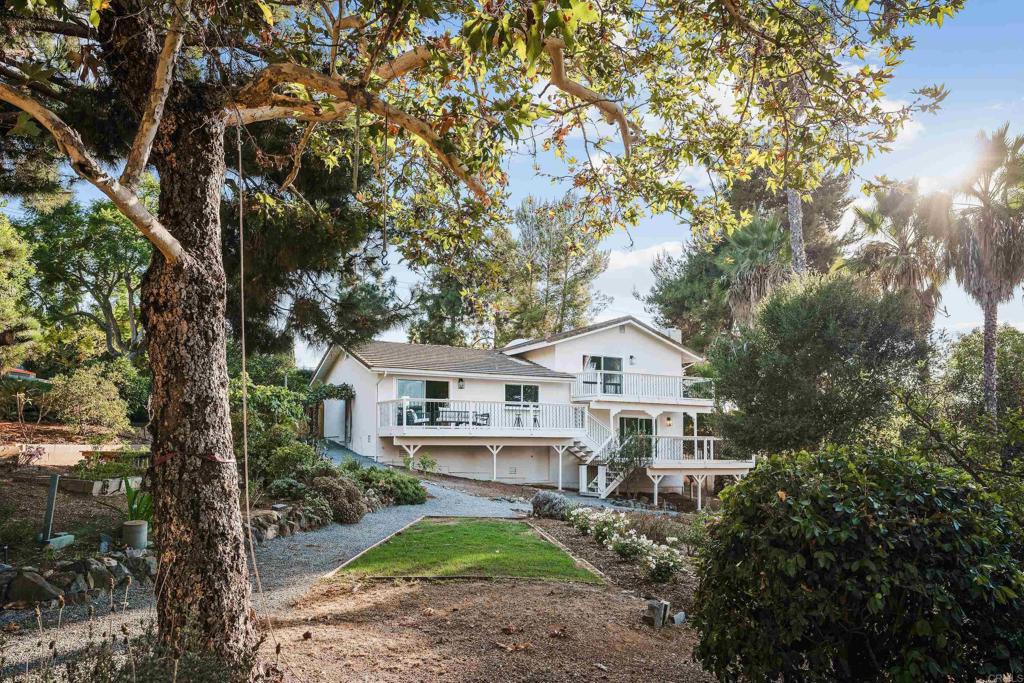 1608 Towell Lane Escondido, CA 92029 - Photo 30 of 35 a view of a house with a yard and large trees
