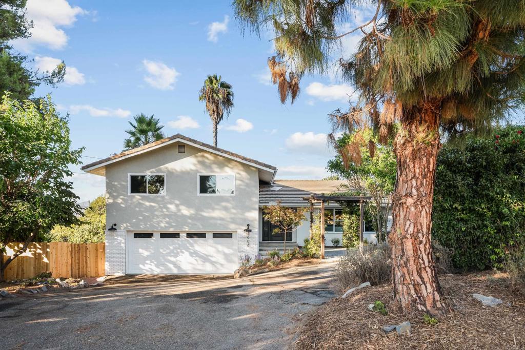 1608 Towell Lane Escondido, CA 92029 - Photo 34 of 35 a view of a house with a yard and palm trees