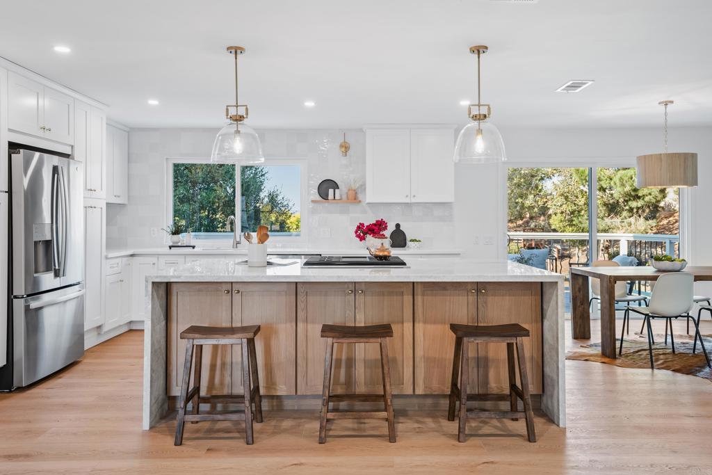 1608 Towell Lane Escondido, CA 92029 - Photo 5 of 35 a kitchen with a table and chairs in it