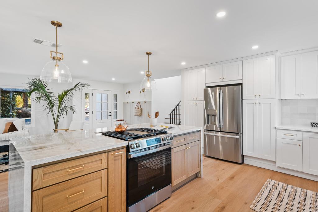 1608 Towell Lane Escondido, CA 92029 - Photo 6 of 35 a kitchen with stainless steel appliances granite countertop a stove a refrigerator and a sink
