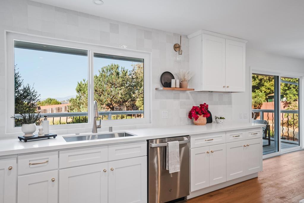 1608 Towell Lane Escondido, CA 92029 - Photo 8 of 35 a kitchen with a sink window and cabinets