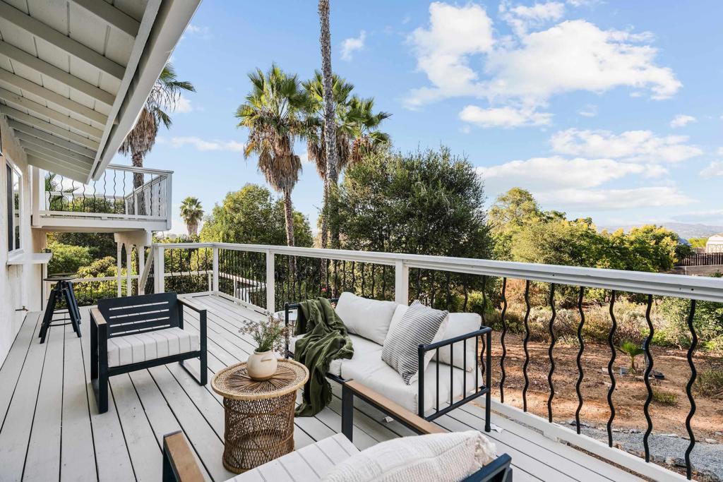 1608 Towell Lane Escondido, CA 92029 - Photo 9 of 35 a view of a balcony with wooden floor and outdoor seating