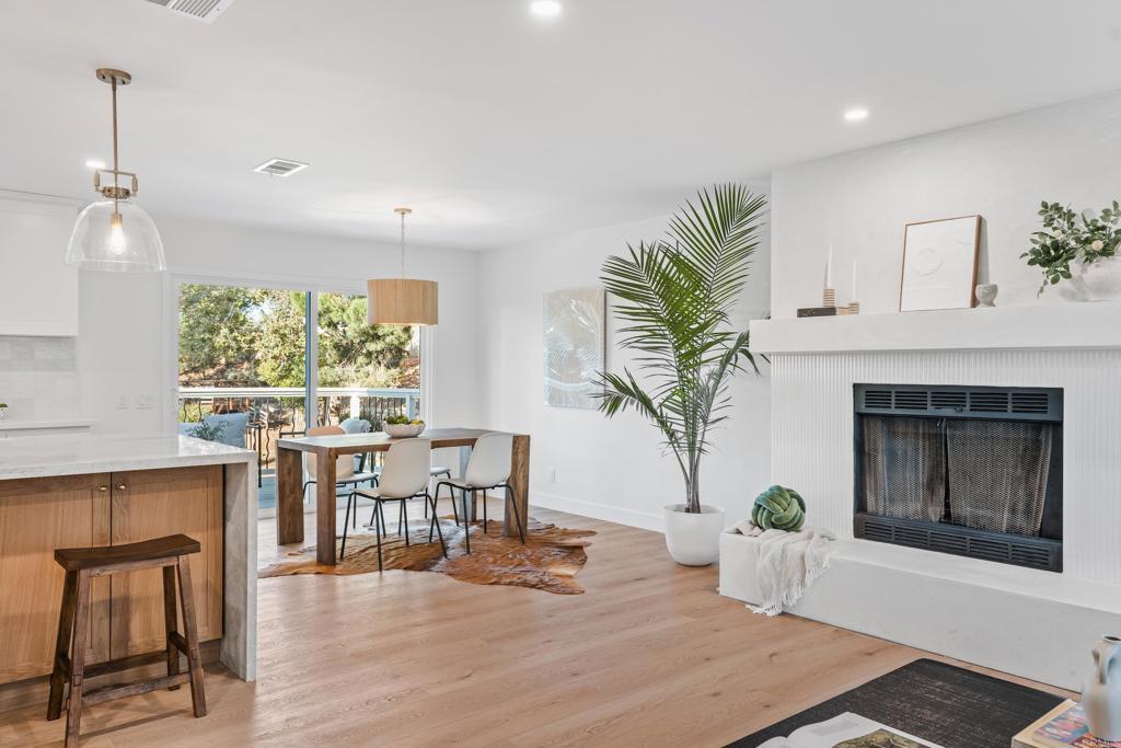 1608 Towell Lane Escondido, CA 92029 - Photo 10 of 35 a living room with furniture a fireplace and a potted plant
