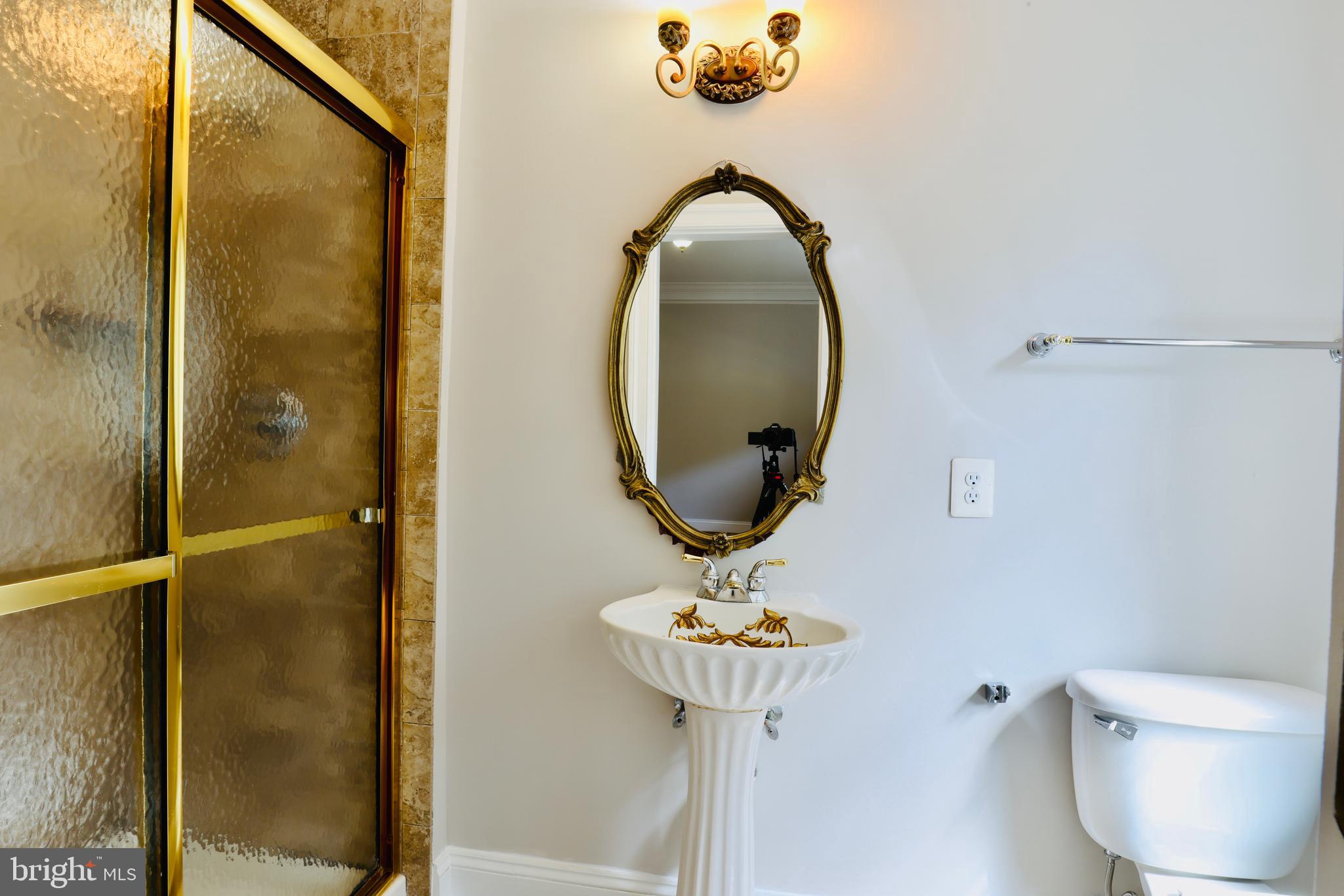 1310 Forestwood Drive McLean, VA 22101 - Photo 15 of 55 a bathroom with a sink and mirror