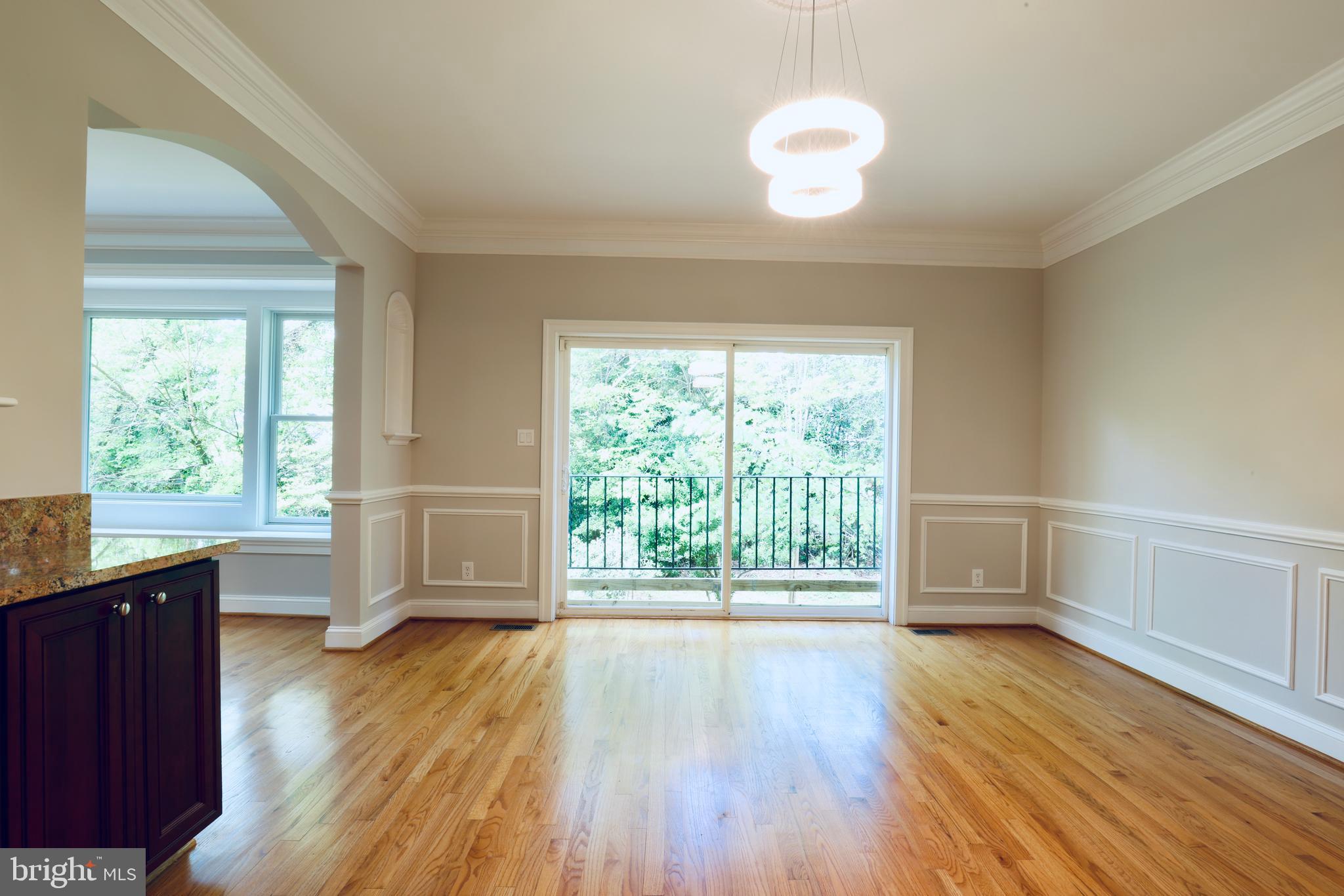 1310 Forestwood Drive McLean, VA 22101 - Photo 17 of 55 a view of an empty room with wooden floor and a window