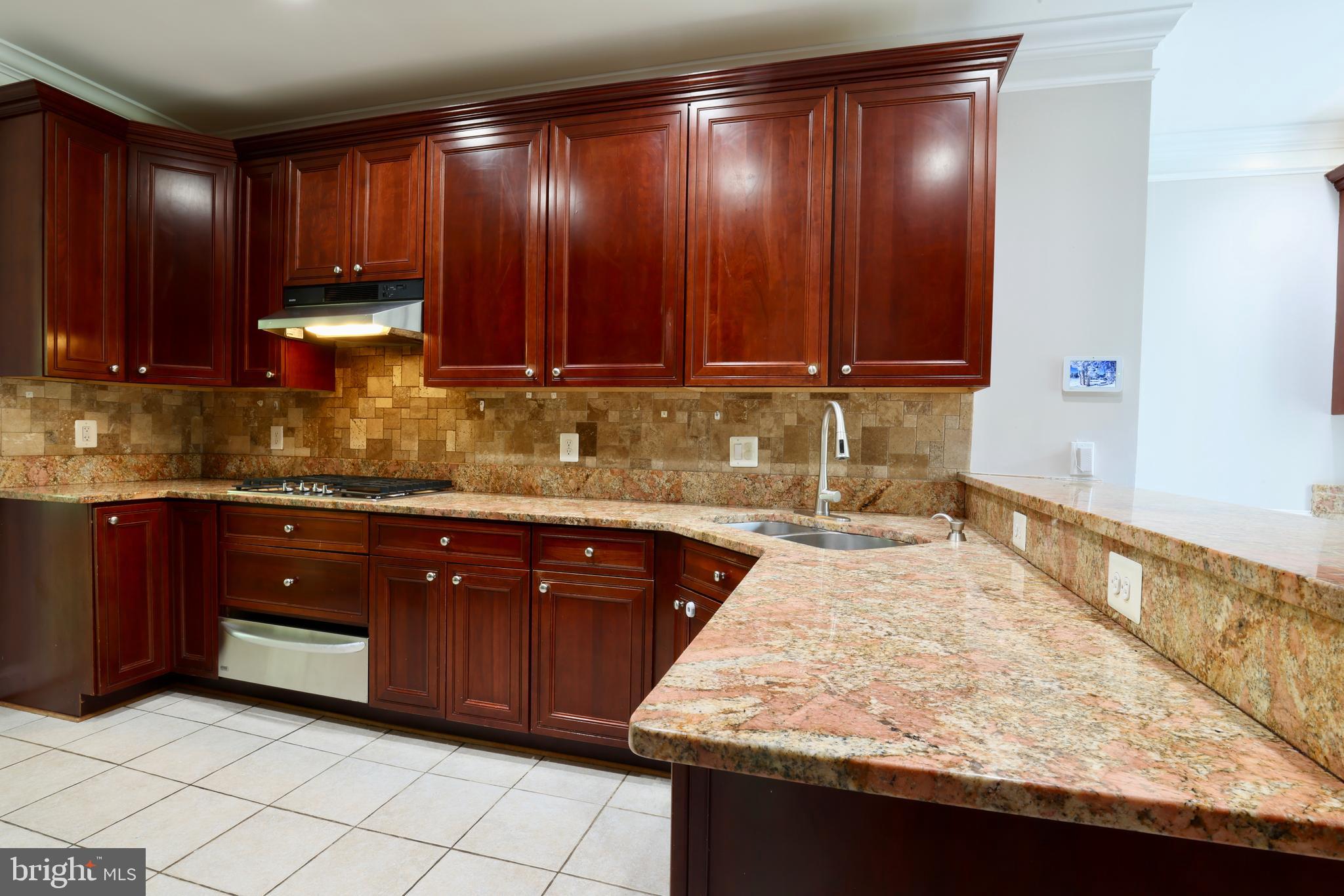 1310 Forestwood Drive McLean, VA 22101 - Photo 19 of 55 a kitchen with wooden cabinets and a sink