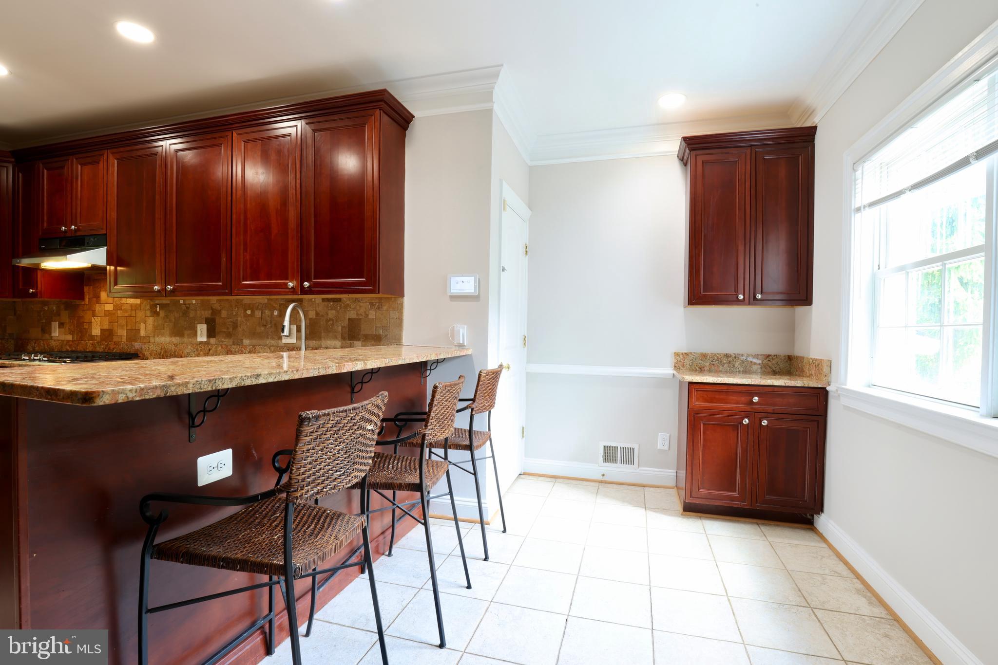 1310 Forestwood Drive McLean, VA 22101 - Photo 21 of 55 a kitchen with a sink cabinets and window