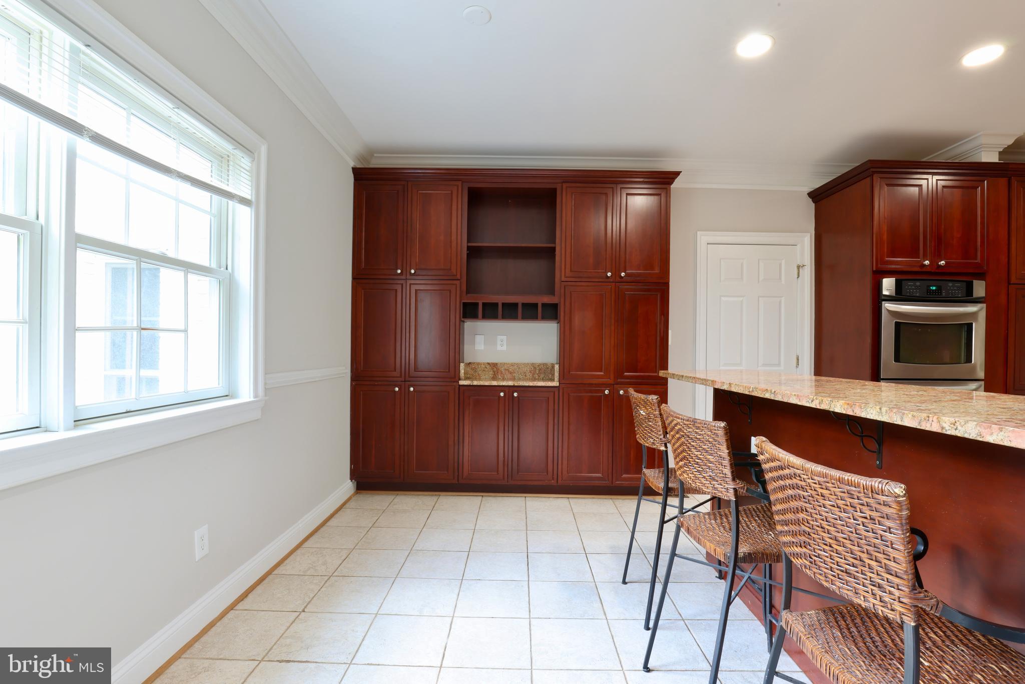 1310 Forestwood Drive McLean, VA 22101 - Photo 22 of 55 a kitchen with stainless steel appliances granite countertop a refrigerator and a stove top oven