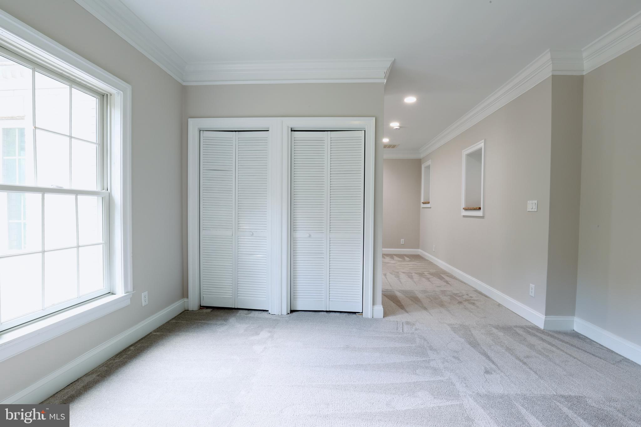 1310 Forestwood Drive McLean, VA 22101 - Photo 28 of 55 an empty room with windows and closet