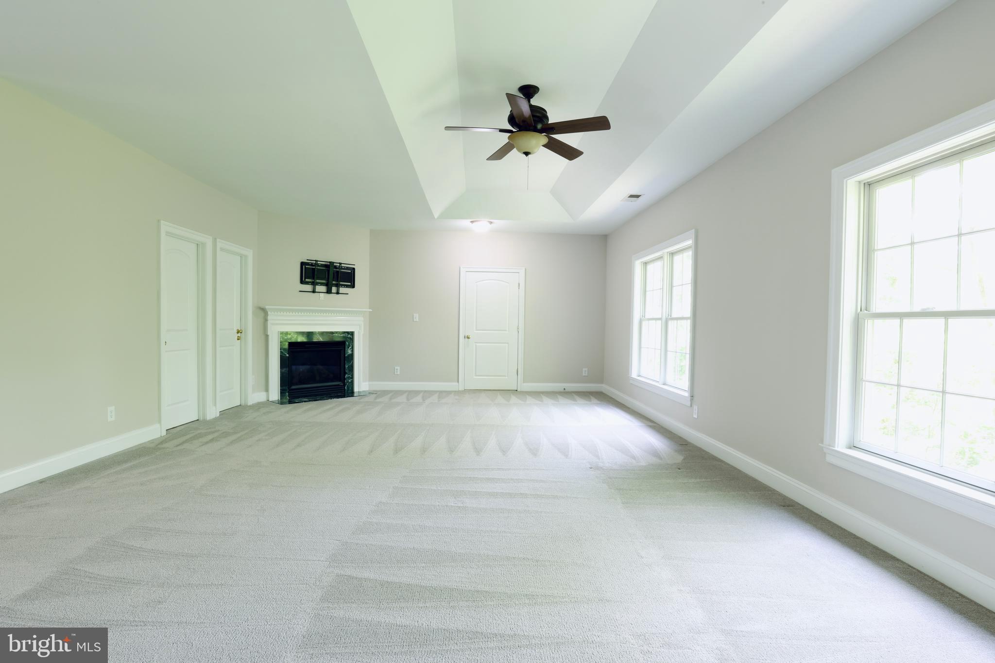 1310 Forestwood Drive McLean, VA 22101 - Photo 31 of 55 a view of empty room with windows and ceiling fan