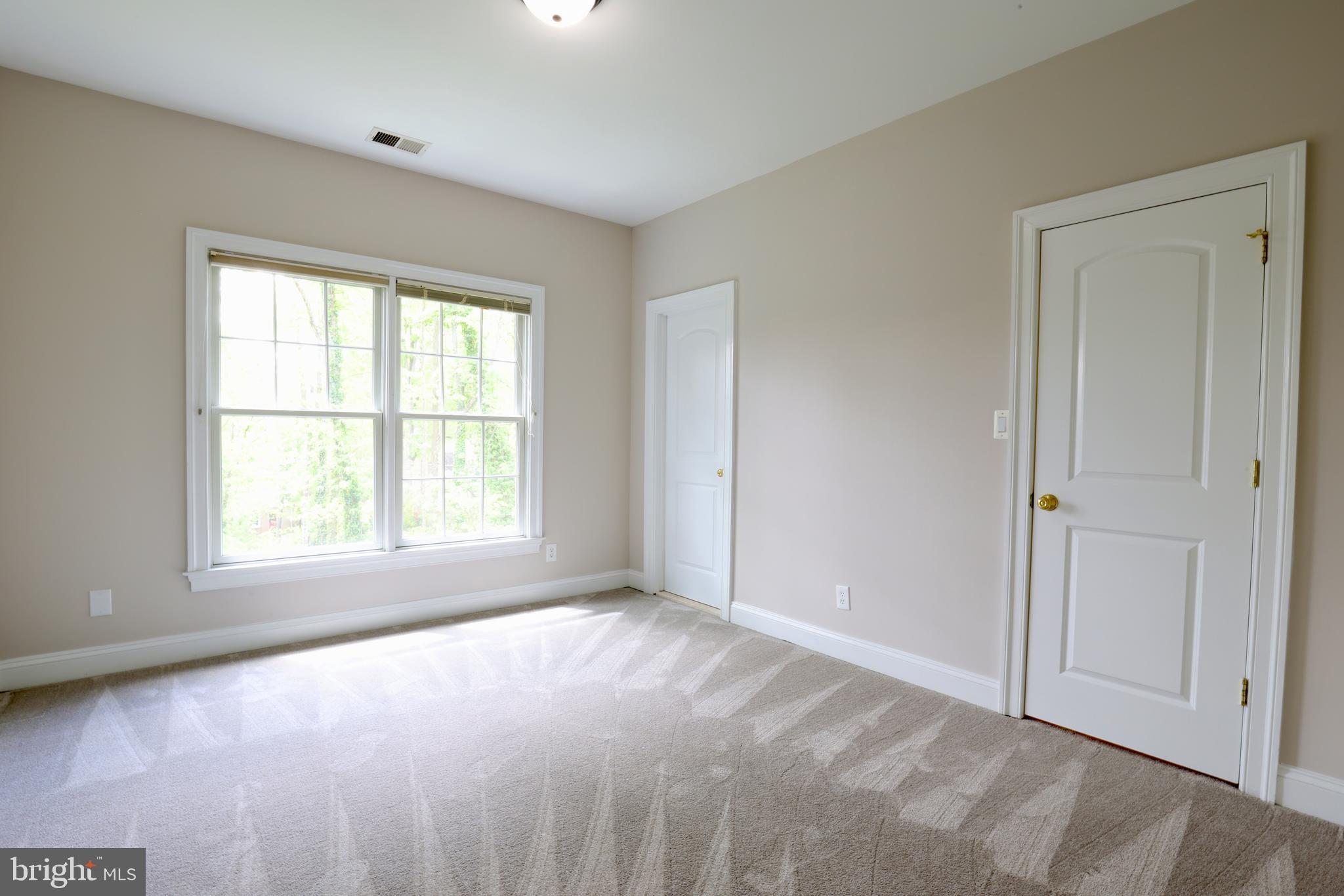 1310 Forestwood Drive McLean, VA 22101 - Photo 40 of 55 a view of an empty room with a window