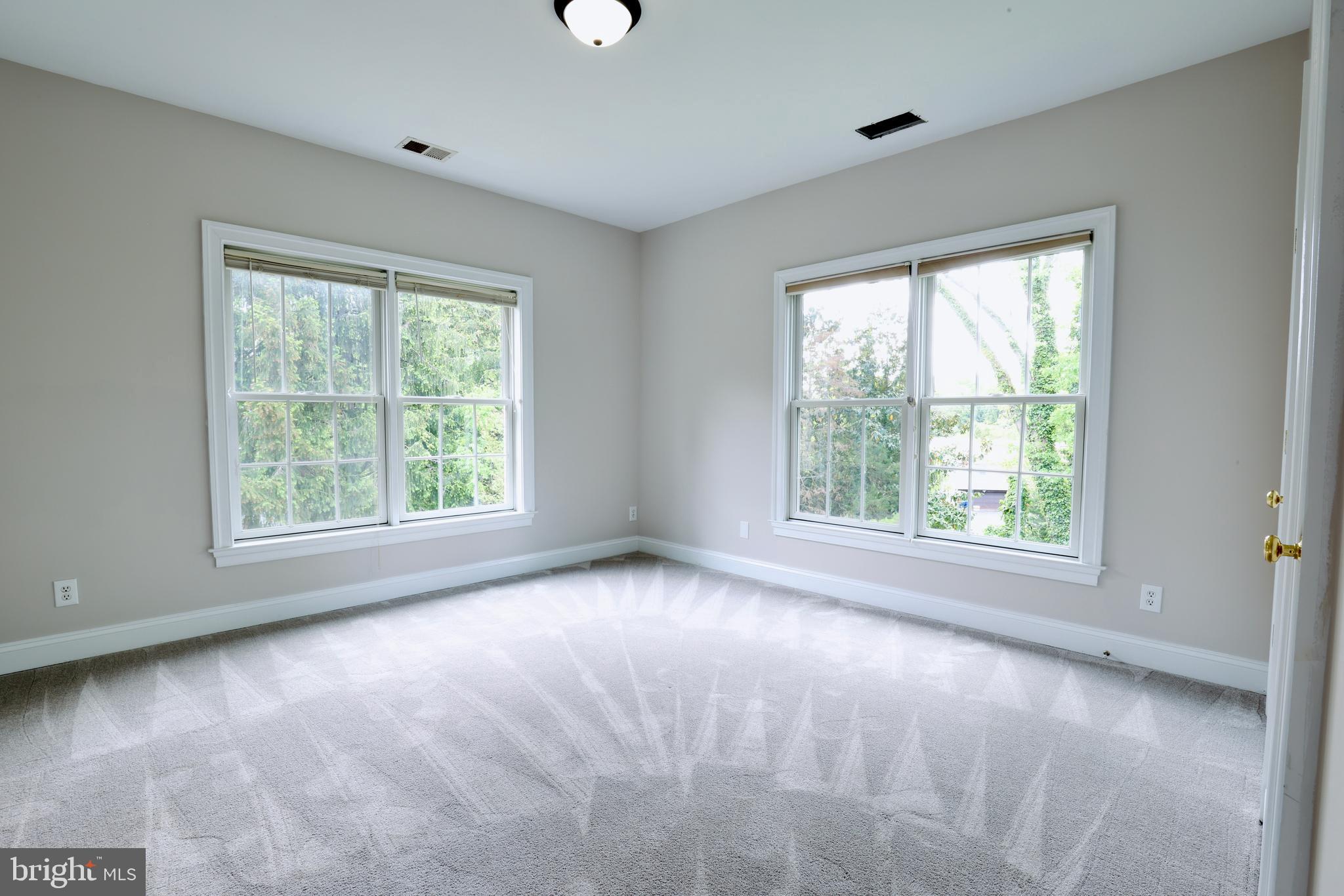1310 Forestwood Drive McLean, VA 22101 - Photo 43 of 55 a view of a big room with windows and chandelier fan