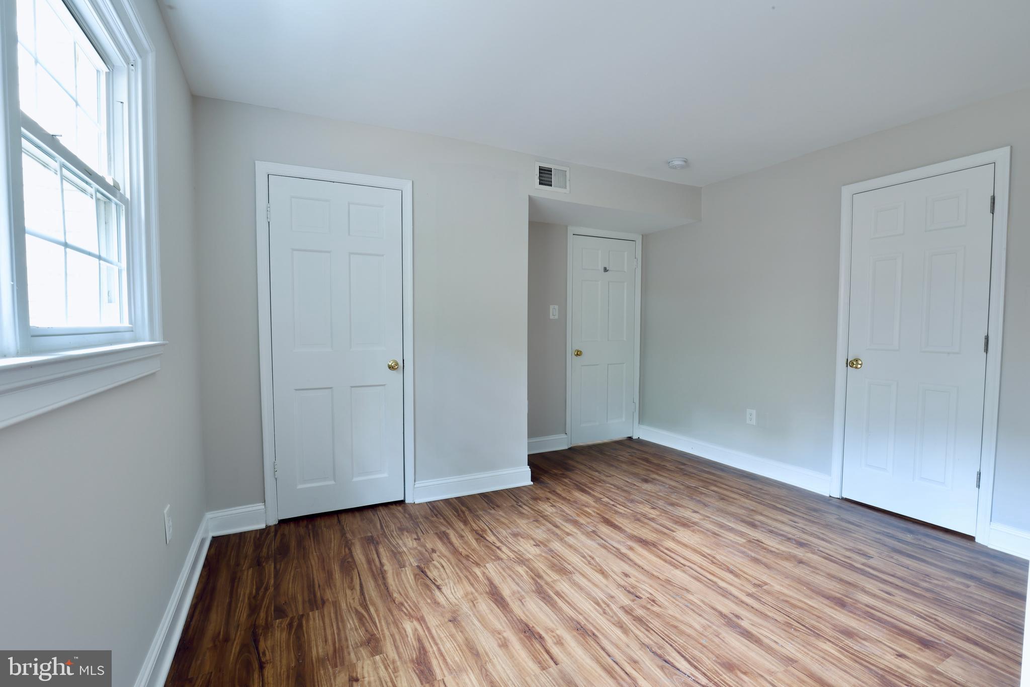 1310 Forestwood Drive McLean, VA 22101 - Photo 47 of 55 a view of an empty room with wooden floor and a window