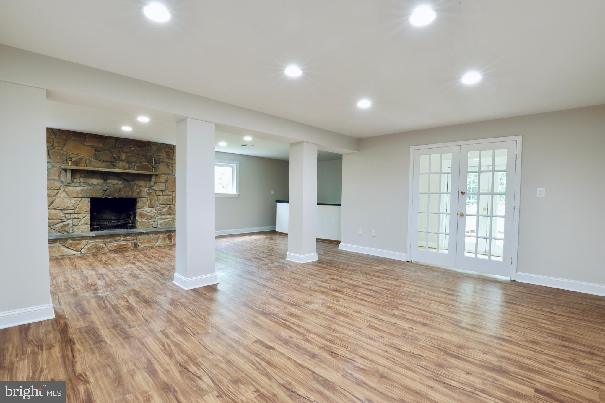 1310 Forestwood Drive McLean, VA 22101 - Photo 48 of 55 a view of an empty room with wooden floor fireplace and a window