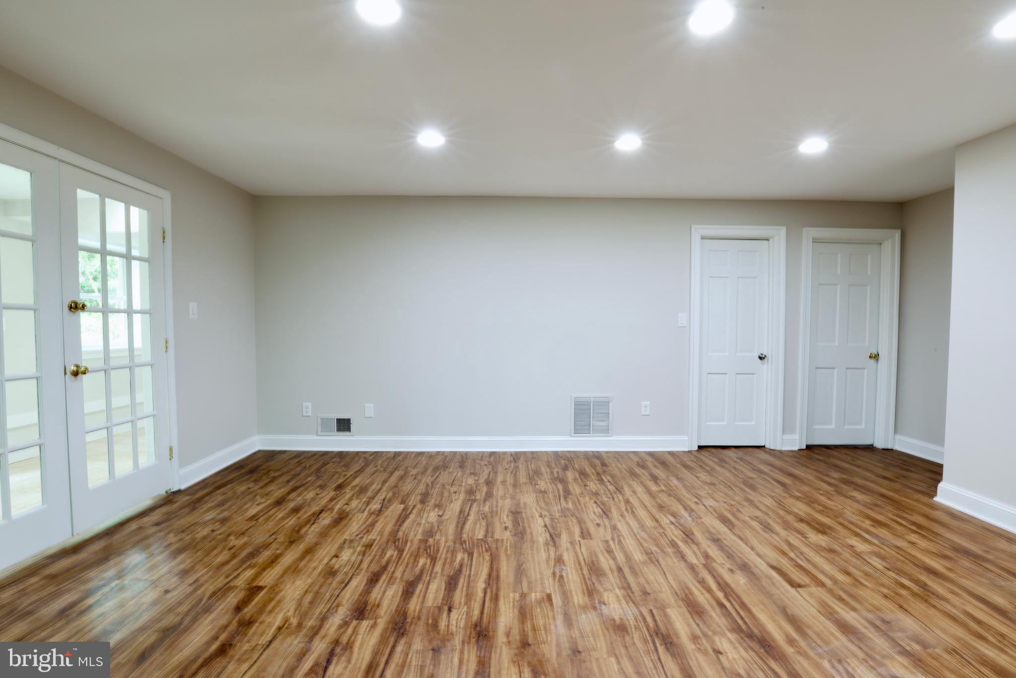 1310 Forestwood Drive McLean, VA 22101 - Photo 49 of 55 a view of an empty room with wooden floor and a window