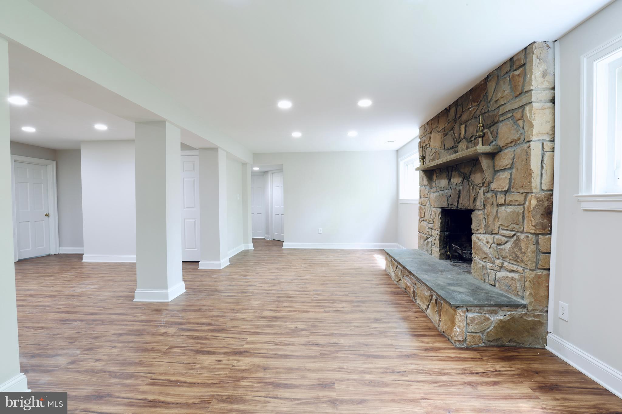 1310 Forestwood Drive McLean, VA 22101 - Photo 51 of 55 a view of a livingroom with wooden floor and a fireplace