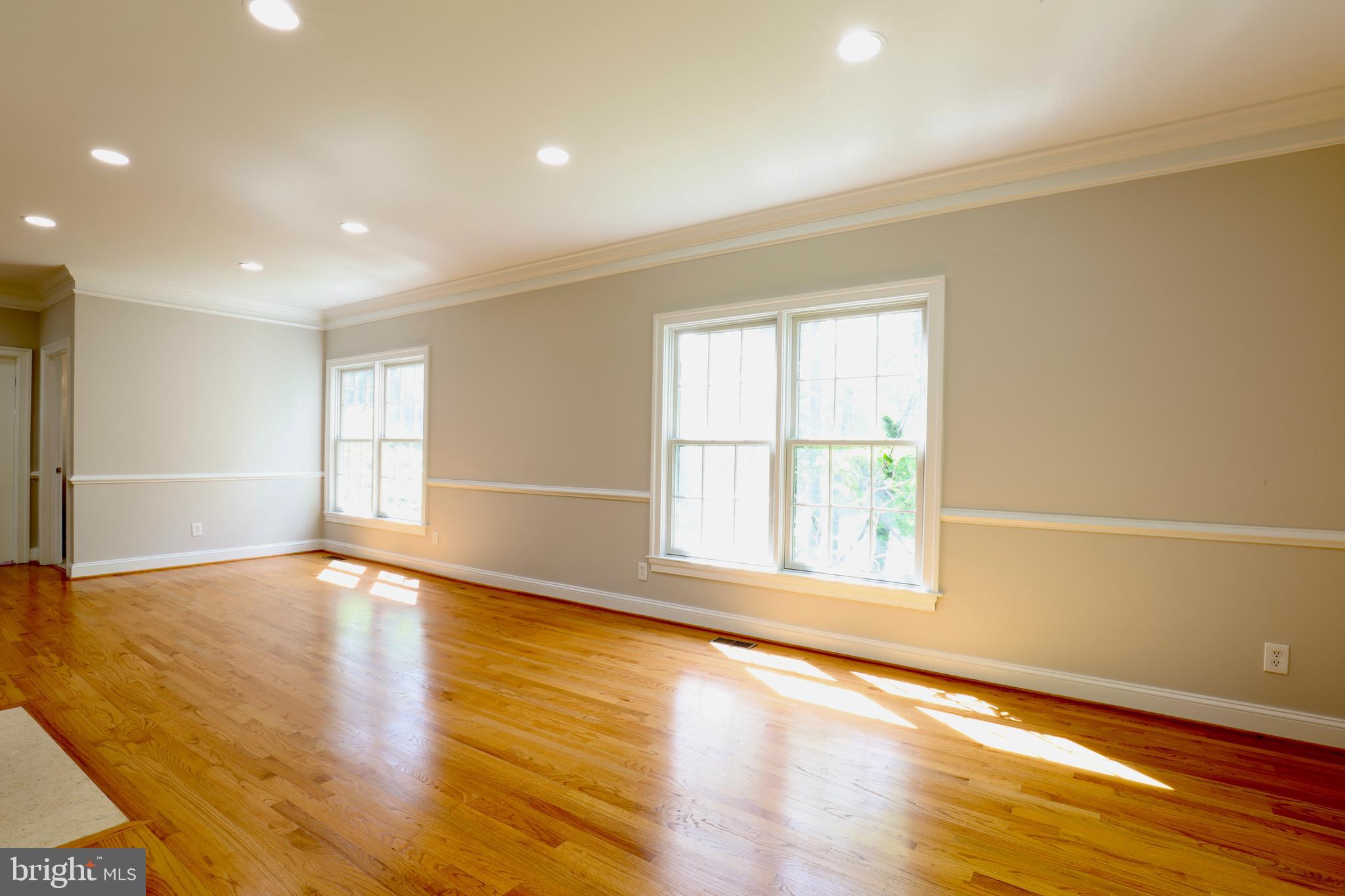 1310 Forestwood Drive McLean, VA 22101 - Photo 8 of 55 a view of an empty room with wooden floor and a window