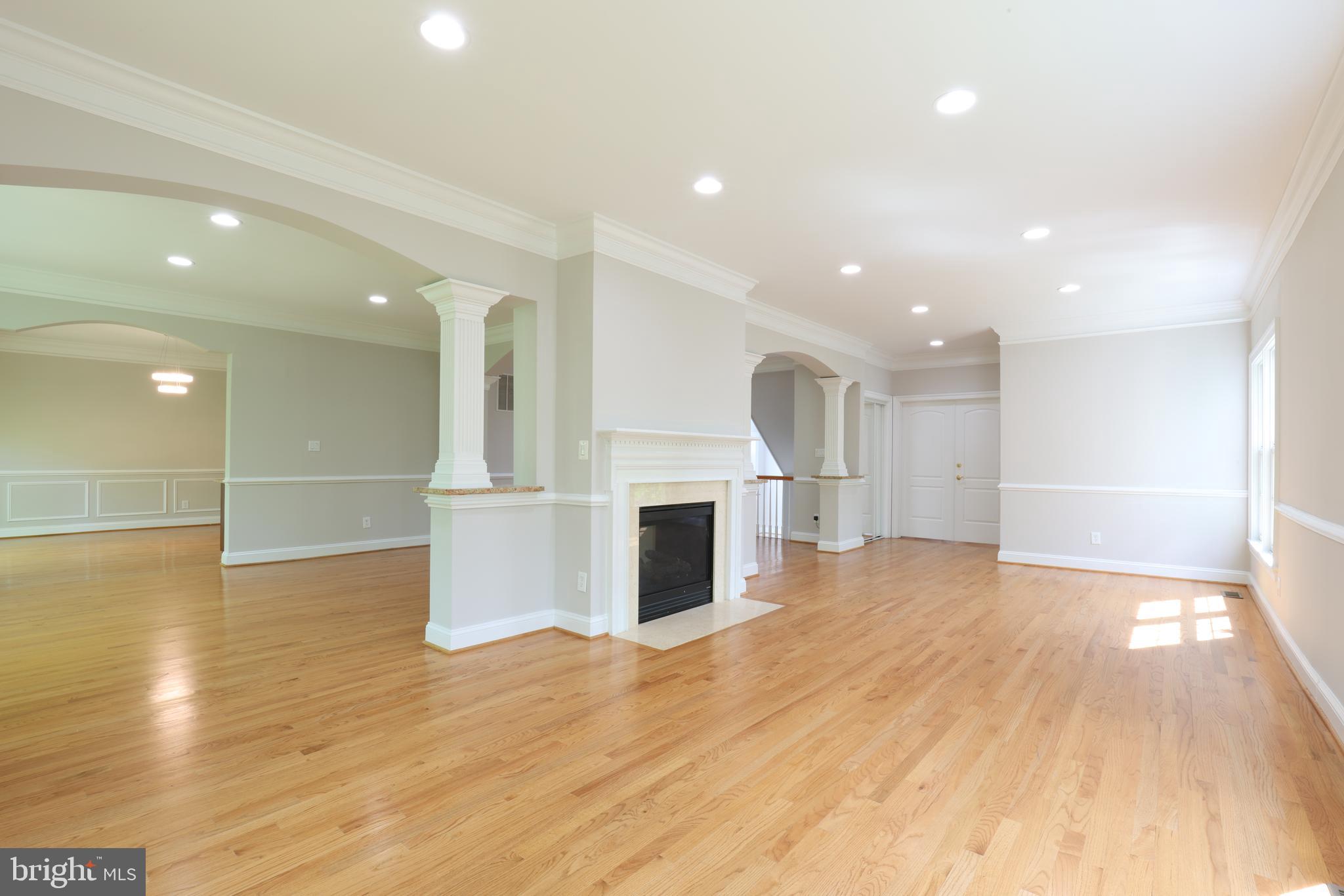 1310 Forestwood Drive McLean, VA 22101 - Photo 9 of 55 a view of a big room with wooden floor and windows