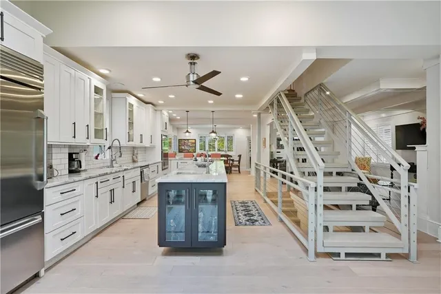 a kitchen with counter top space cabinets and stainless steel appliances