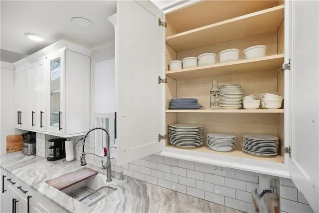 a bedroom with a large bed and furniture