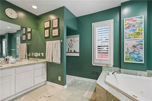 a bathroom with a bathtub and a sink