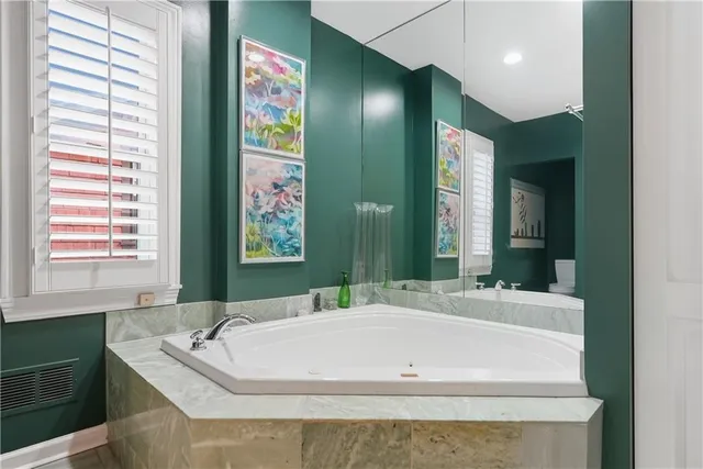 a room with a bed and a flat screen tv