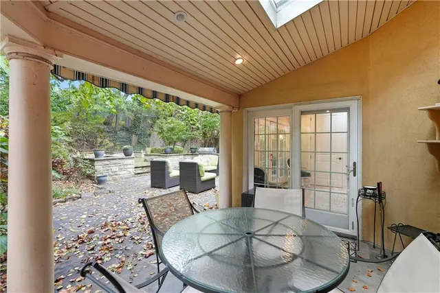 a view of a chairs and table in the patio