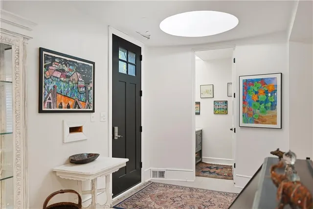 a bathroom with double vanity sink and a mirror