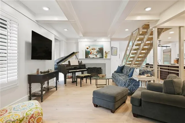 a living room with furniture a rug and a fireplace