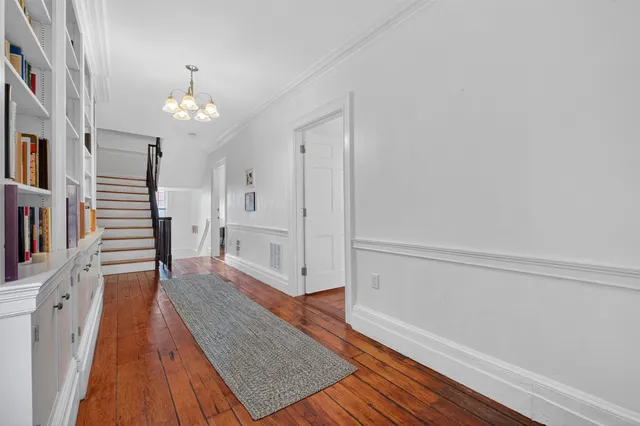 a bed room with a bed and a chair