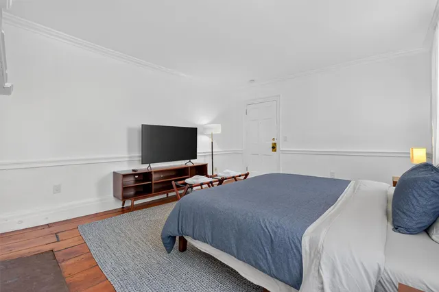 a bathroom with a shower and a curtain