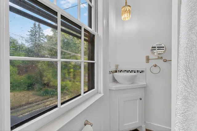 a front view of a house with a yard table and chairs