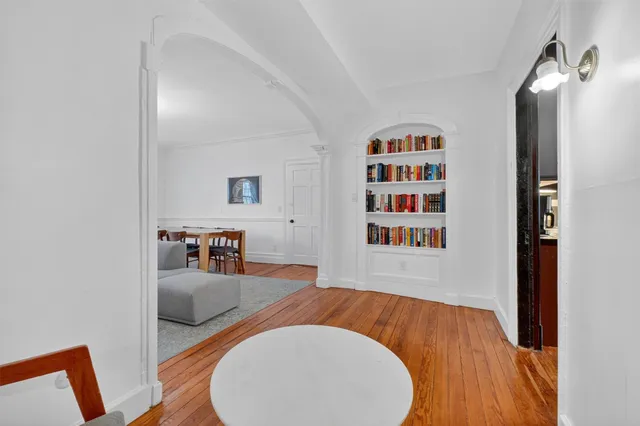 a view of an entryway with wooden floor and stairs