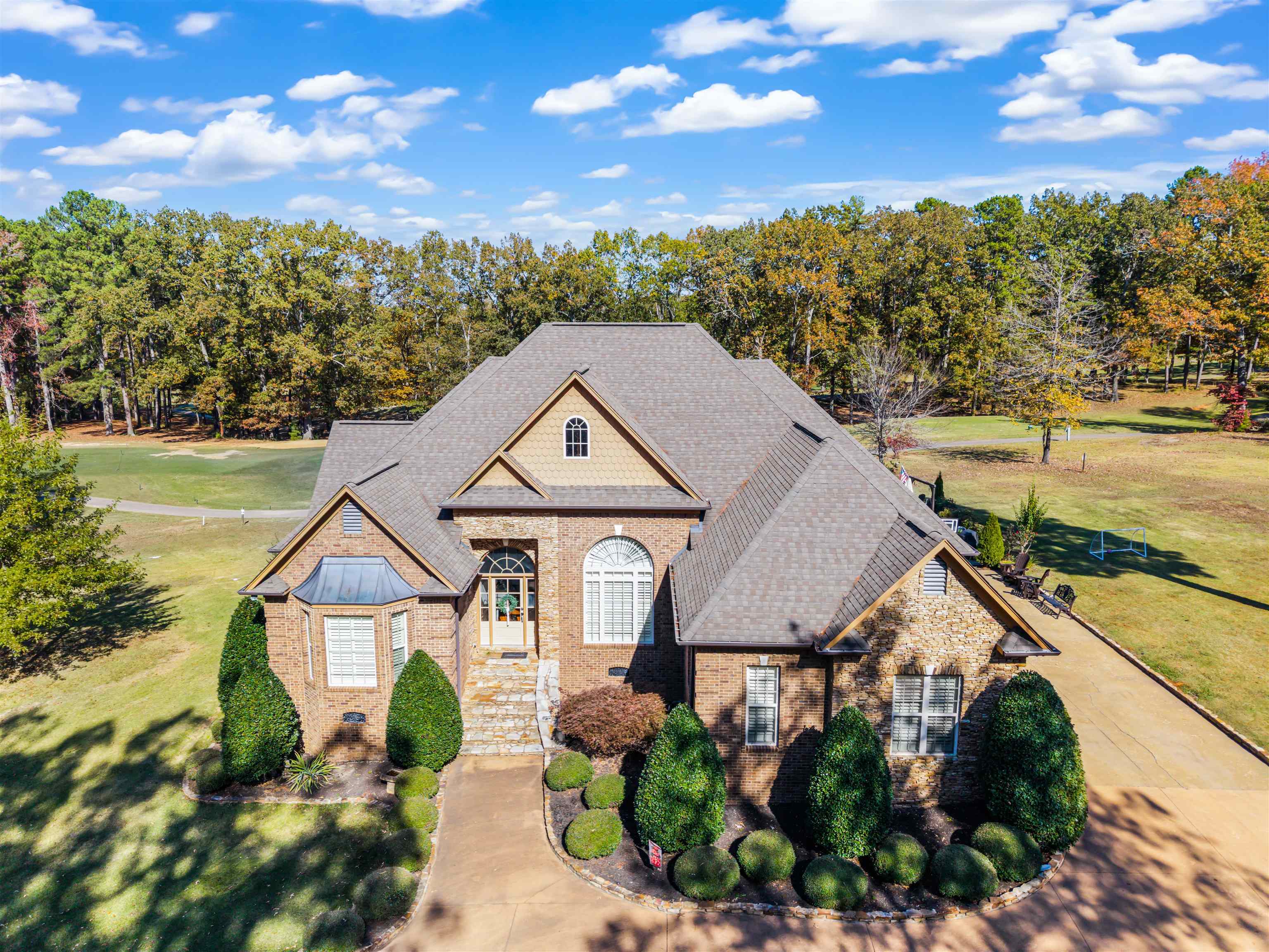 140 Legends Drive Counce, TN 38326 - Photo 1 of 30 View of front of home featuring roof with shingles, a front yard, brick siding, and view of scattered trees