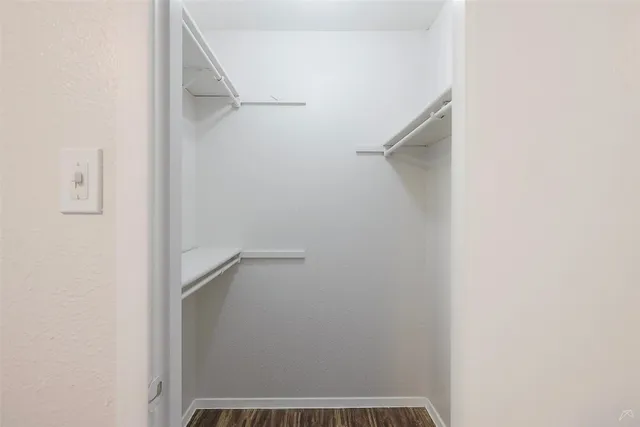 a view of an empty walk in closet