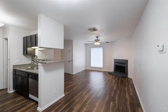 a kitchen with stainless steel appliances granite countertop a stove oven and a refrigerator
